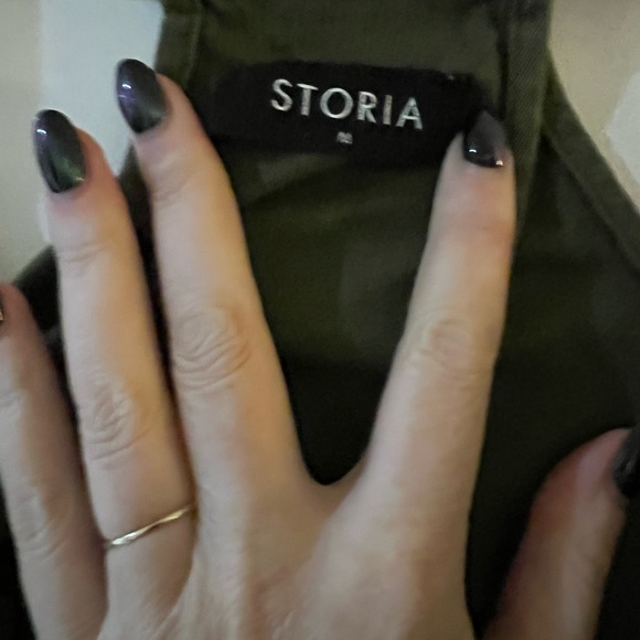 Hunter green overalls with black stars. Size medium. Fits small - Picture 2 of 3